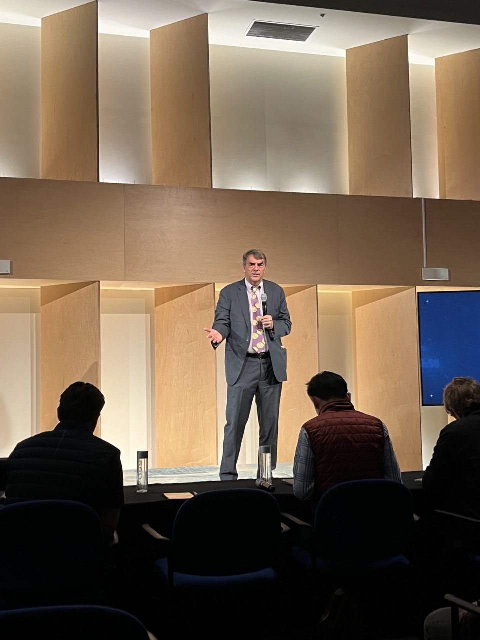 Tim Draper speaking on stage